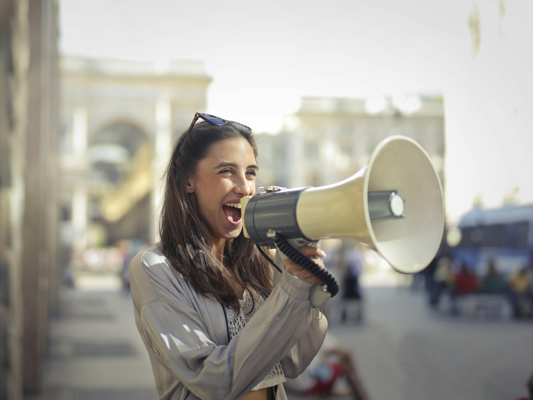 woman using megaphone to talk